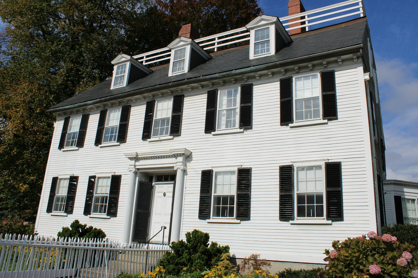 White colonial-style residence (illustrative)
